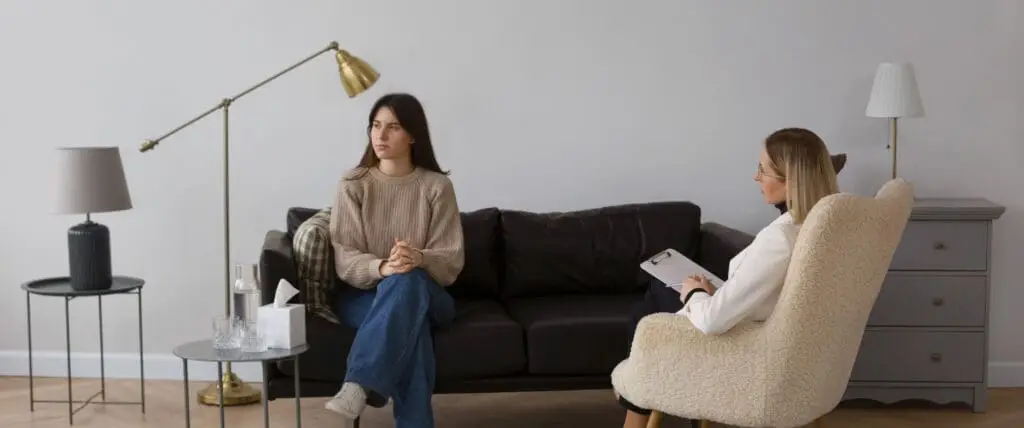 Therapist meeting with a client in a private counseling office