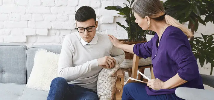 Therapists supporting a family during a counseling session
